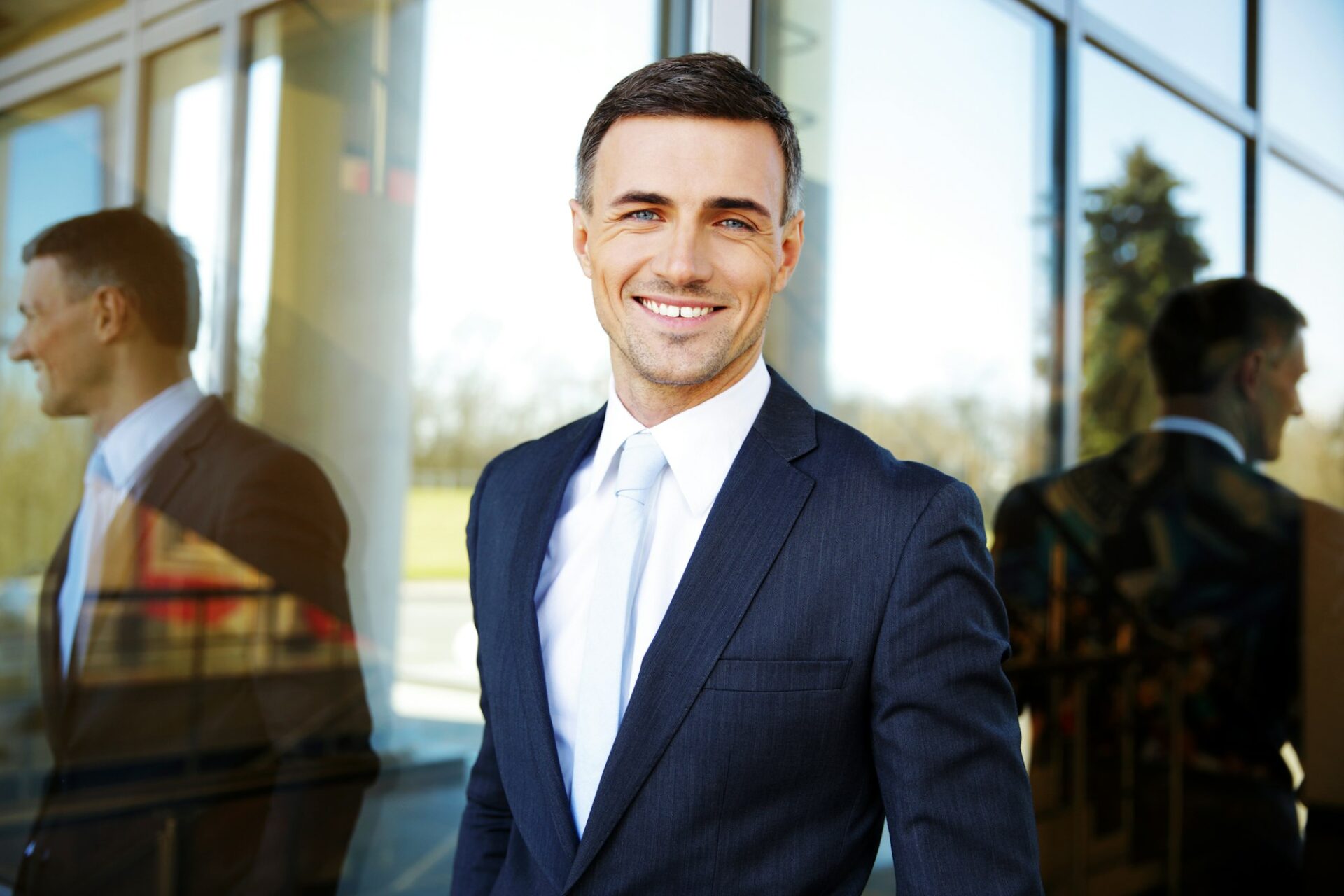 Portrait of a smiling handsome businessman in suit